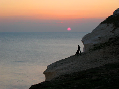 A couple watching the sunset from the Seven Sisters