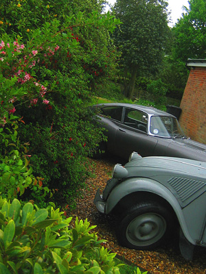 Old Citroen van and Jaguar E-type in driveway, Hebing End, Benington, Hertfordshire, England, Britain, UK