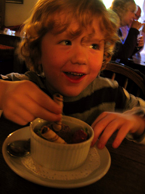 Zac eating dessert at the Farmers Arms pub, Combe Florey