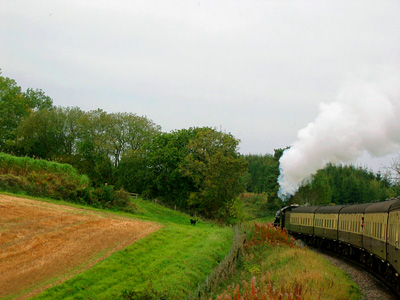 West Somerset Railway steam train climbing a hilll near Crowcombe