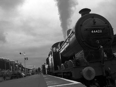 Black and white image of steam locomotive on the West Somerset Railway